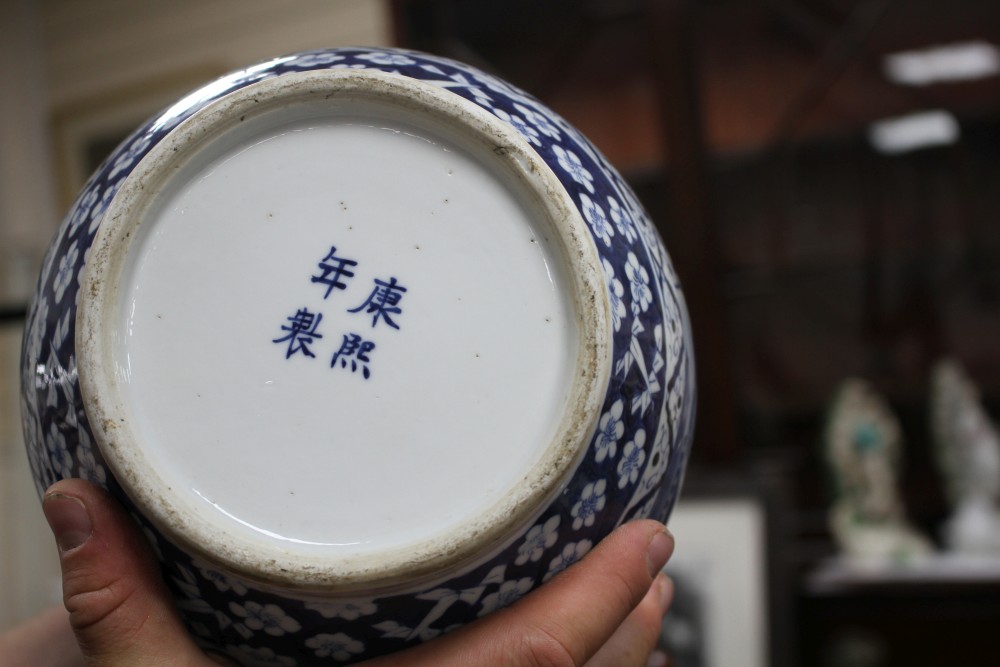 A pair of 19th century Chinese blue and white vases, decorated with panels of figures in gardens, four character marks, height 34.5cm